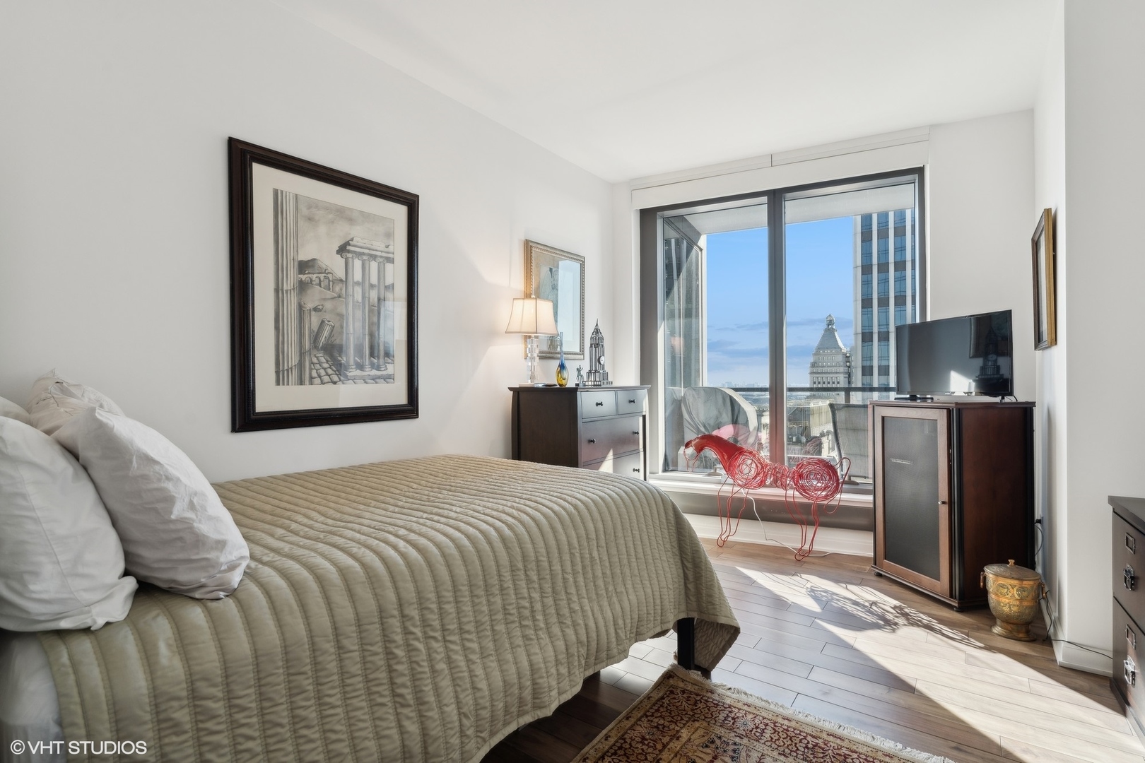 60 East Monroe Street, Unit 2903 Chicago, IL 60603 - Photo 8 of 19 a bedroom with a bed furniture and a window