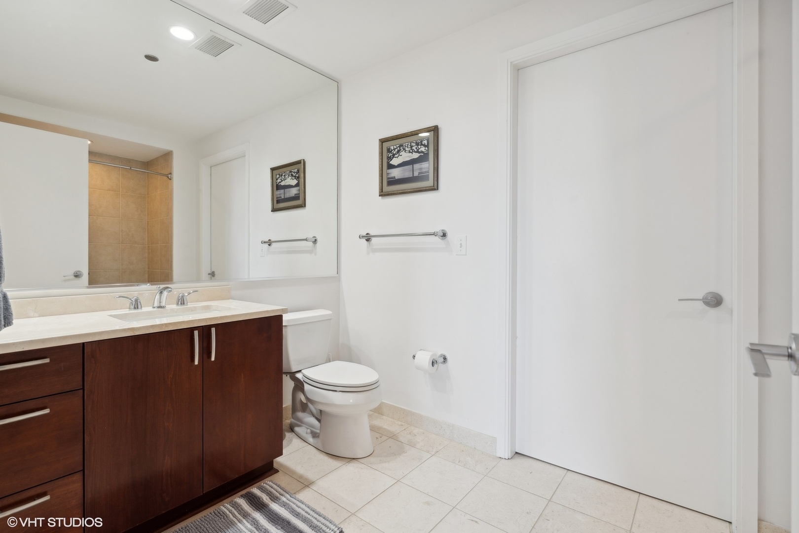 60 East Monroe Street, Unit 2903 Chicago, IL 60603 - Photo 9 of 19 a bathroom with a sink and mirror