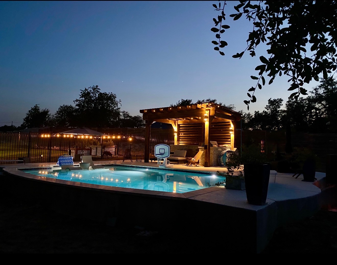 14302 Summit View Drive, Unit 4 Leander, TX 78641 - Photo 24 of 40 Pool at dusk with a patio, a fenced backyard, and a gazebo