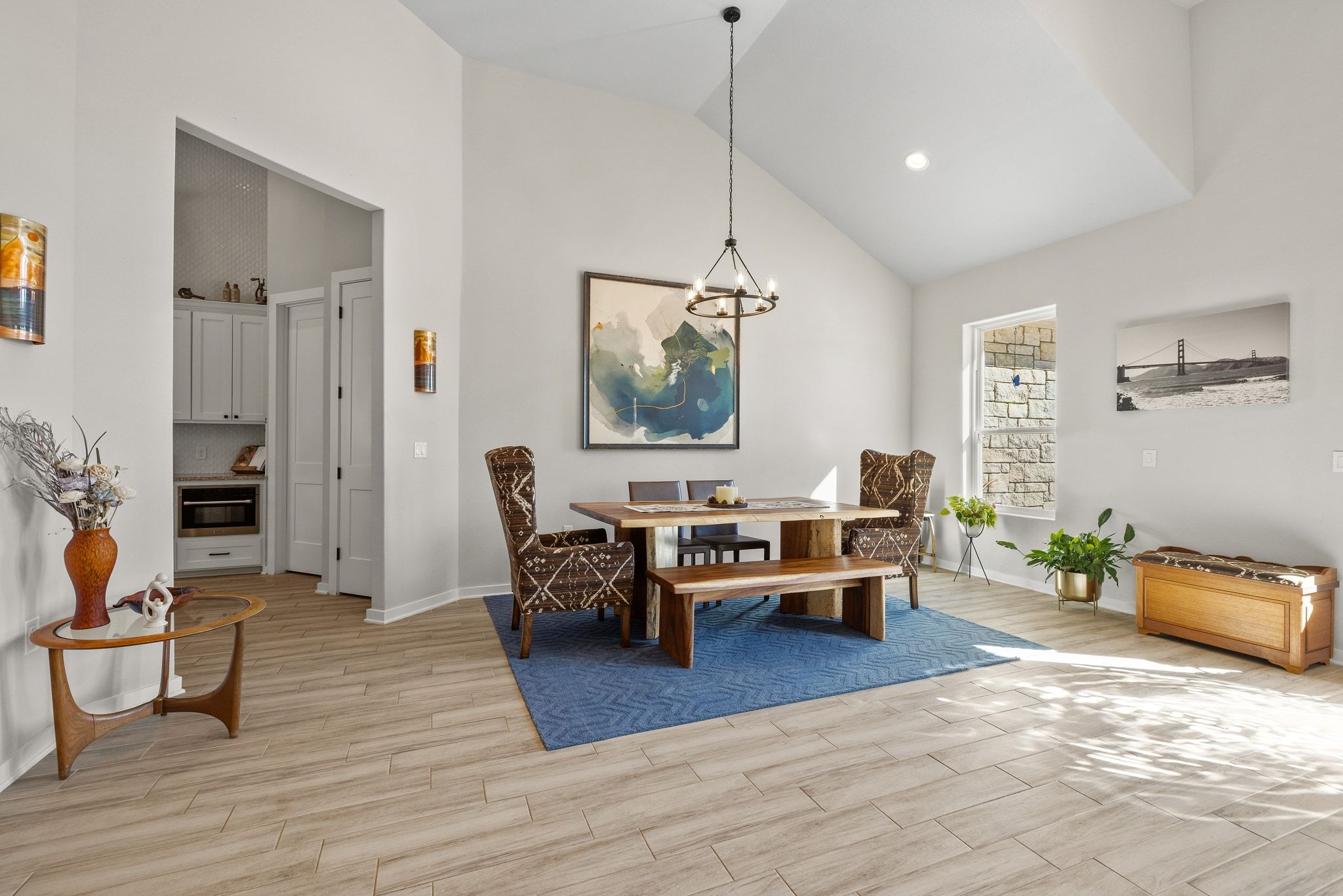 14302 Summit View Drive, Unit 4 Leander, TX 78641 - Photo 10 of 40 Dining area with lofted ceiling, wood finish floors, and hanging lights