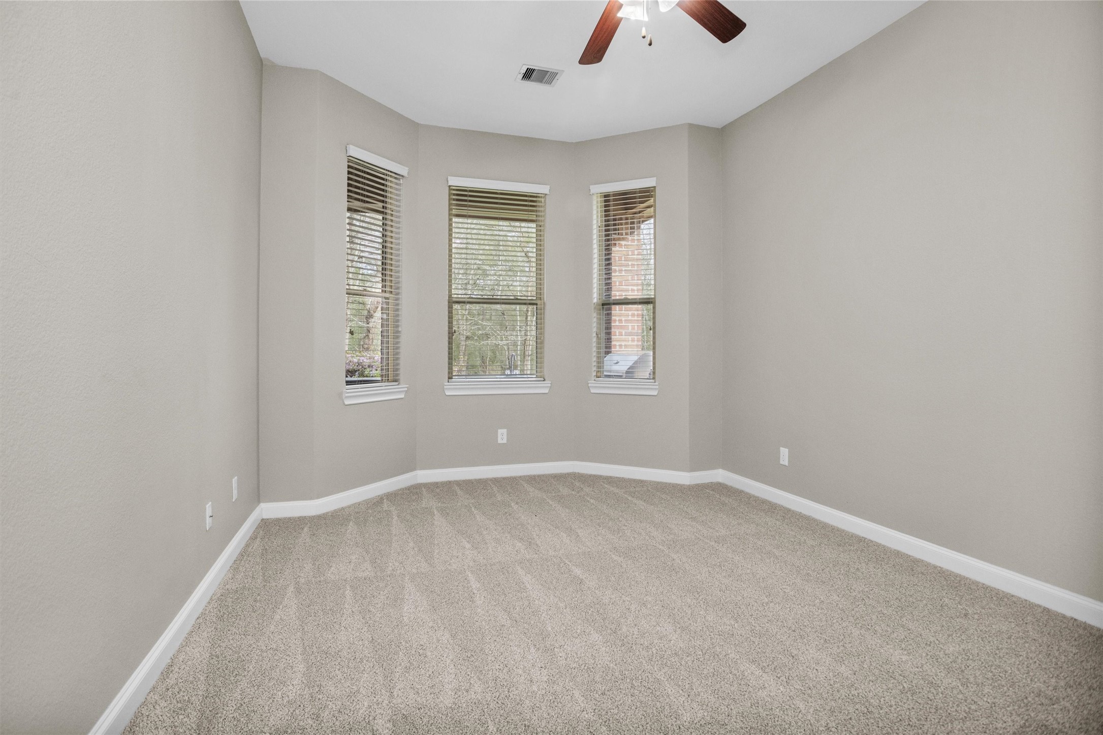 27910 Hansons Court Spring, TX 77386 - Photo 24 of 50 Fourth bedroom with bay windows, fresh paint, new carpet and pad, spacious walk-in closet. Located direclty adjacent to additional full bath