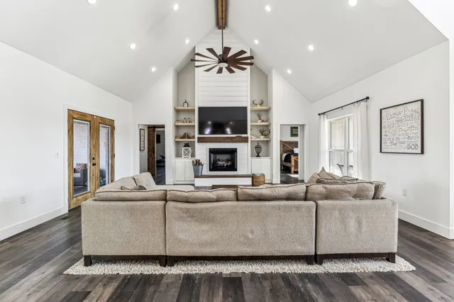 a dining room with furniture and wooden floor