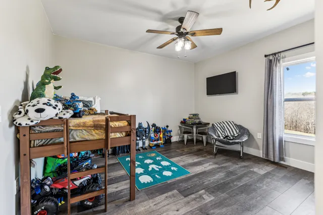 a kitchen with stainless steel appliances granite countertop a refrigerator a stove and a sink