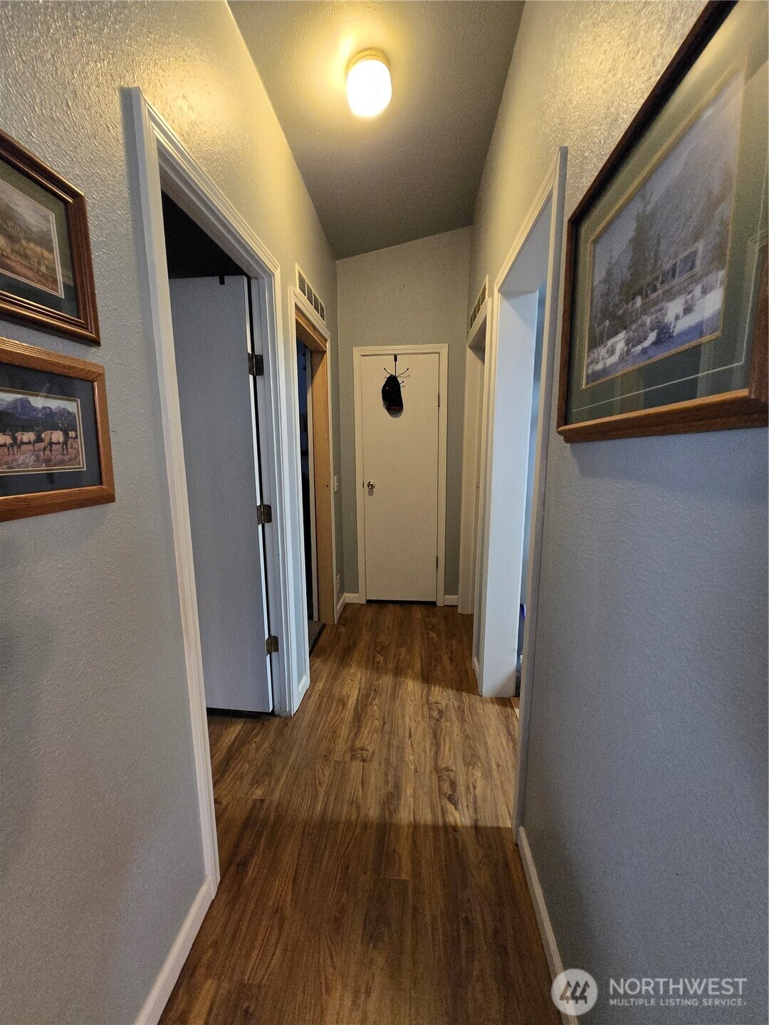1466 Ferrier Road Winlock, WA 98596 - Photo 12 of 33 a view of a hallway with wooden floor