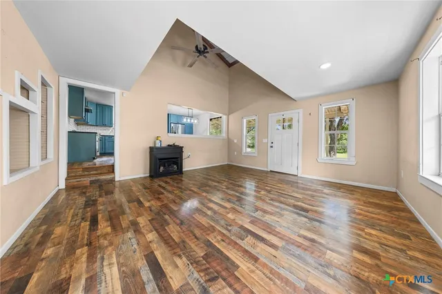 a view of a hallway with wooden shelves