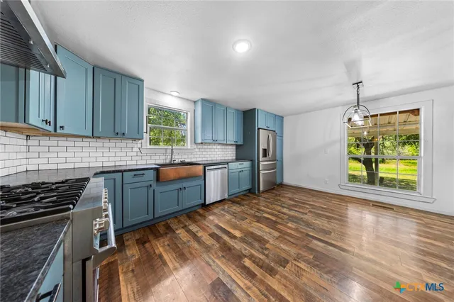 a kitchen with a stove and a microwave