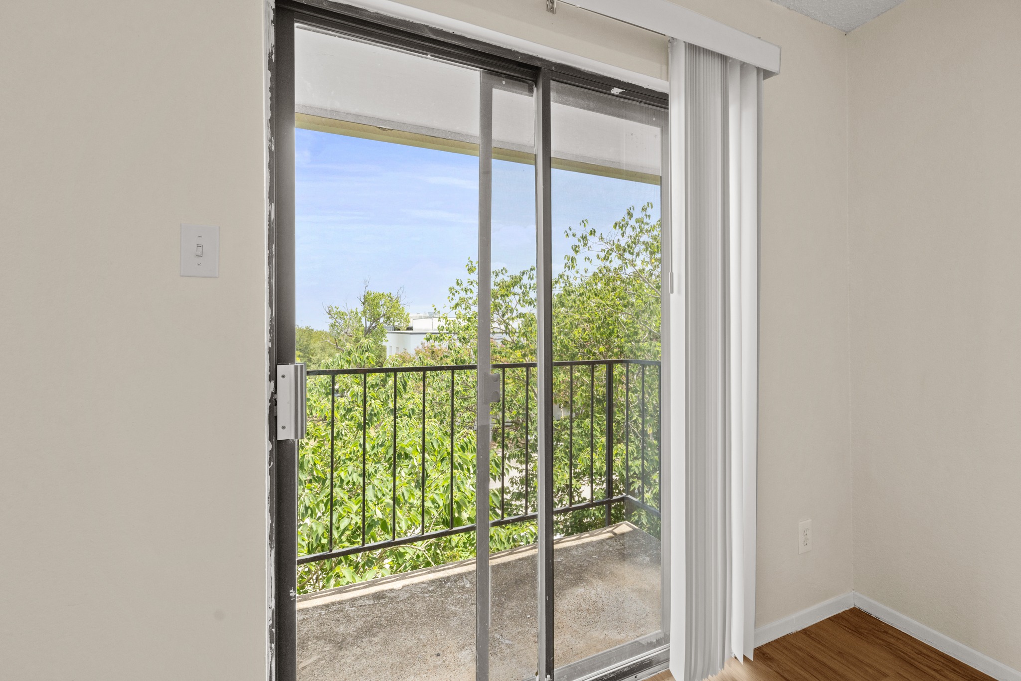 9079 Jollyville Road, Unit 301 Austin, TX 78759 - Photo 11 of 38 #301 Step out onto this balcony with lush green views, perfect for peaceful mornings.