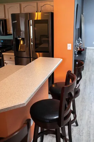 a kitchen with a table and chairs in it