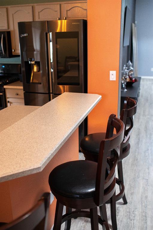 2577 Oneida Loop Kissimmee, FL 34747 - Photo 12 of 36 a kitchen with a table and chairs in it