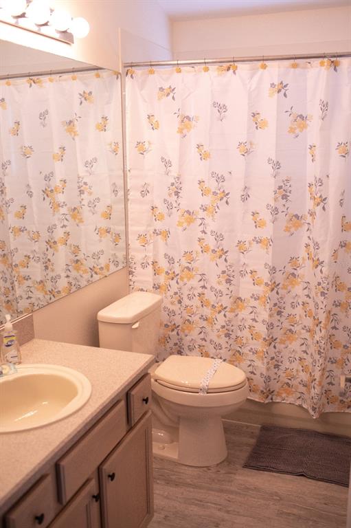 2577 Oneida Loop Kissimmee, FL 34747 - Photo 22 of 36 a bathroom with a toilet and a sink