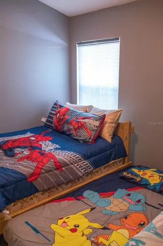 a bedroom with a bed and a small closet