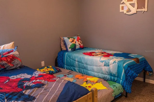 a bedroom with a bed and a small yard