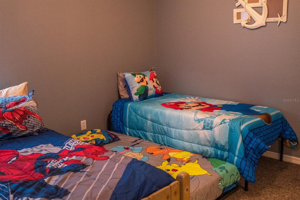 2577 Oneida Loop Kissimmee, FL 34747 - Photo 29 of 36 a bedroom with a bed and a small closet