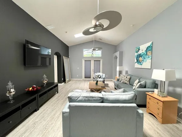 a living room with furniture and a flat screen tv