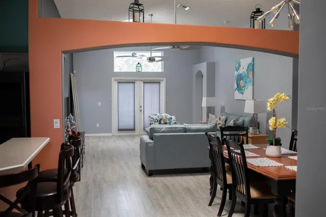 a view of a dining room with furniture and wooden floor