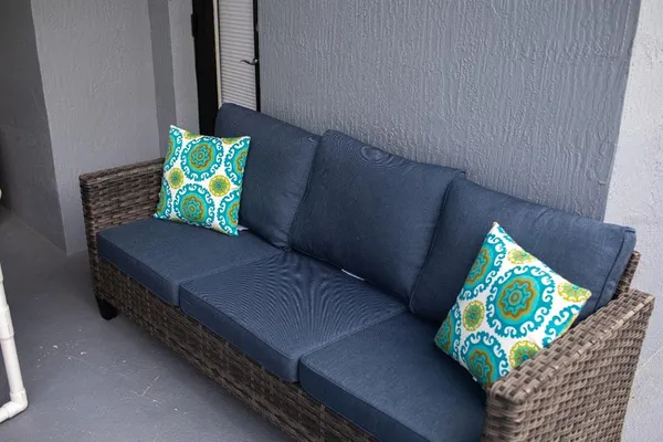 a wooden bench sitting in front of a building