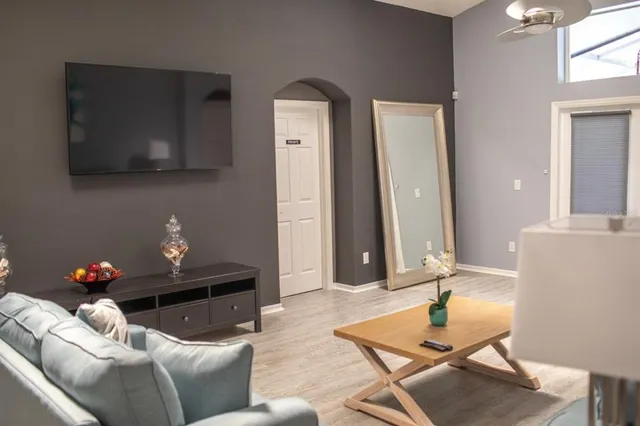 a living room with furniture and a flat screen tv