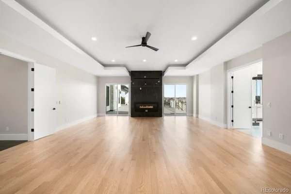 a bathroom with a double vanity sink a toilet a mirror and shower