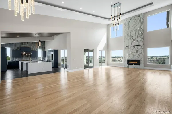 a large kitchen with kitchen island a large counter space a sink stainless steel appliances and cabinets