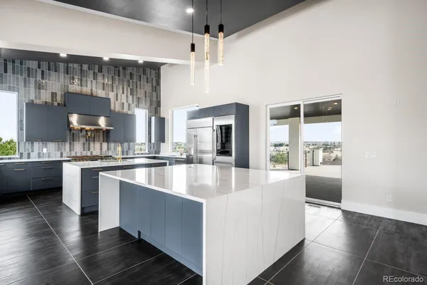 an empty room with a ceiling fan and window