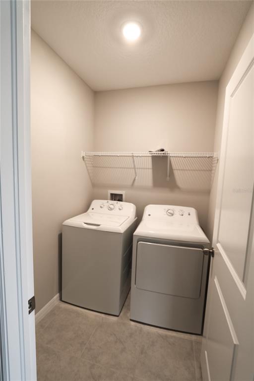 4714 Norman Oak Place Tampa, FL 33619 - Photo 18 of 32 a utility room with dryer and washer
