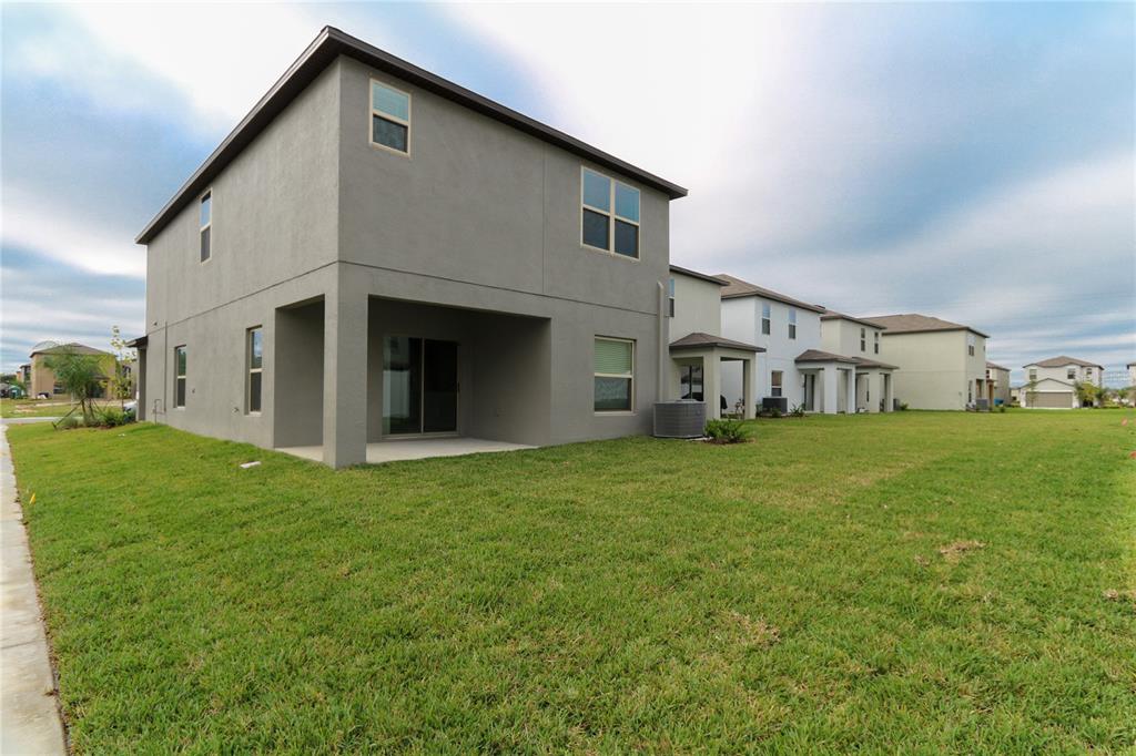 4714 Norman Oak Place Tampa, FL 33619 - Photo 19 of 32 a view of an house with backyard and garden