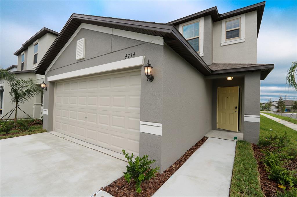 4714 Norman Oak Place Tampa, FL 33619 - Photo 20 of 32 a front view of a house with a yard