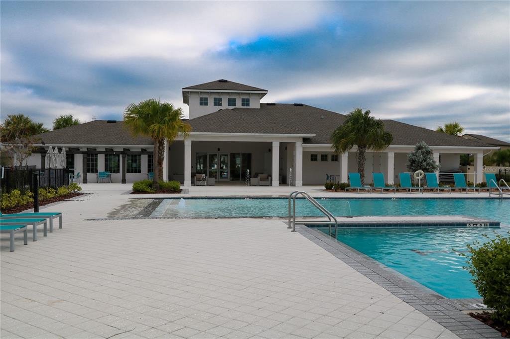 4714 Norman Oak Place Tampa, FL 33619 - Photo 26 of 32 a view of house with a big yard and large trees