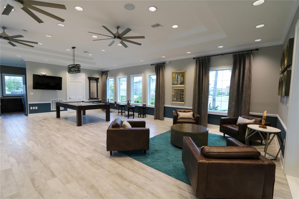4714 Norman Oak Place Tampa, FL 33619 - Photo 27 of 32 a living room with furniture and a large window