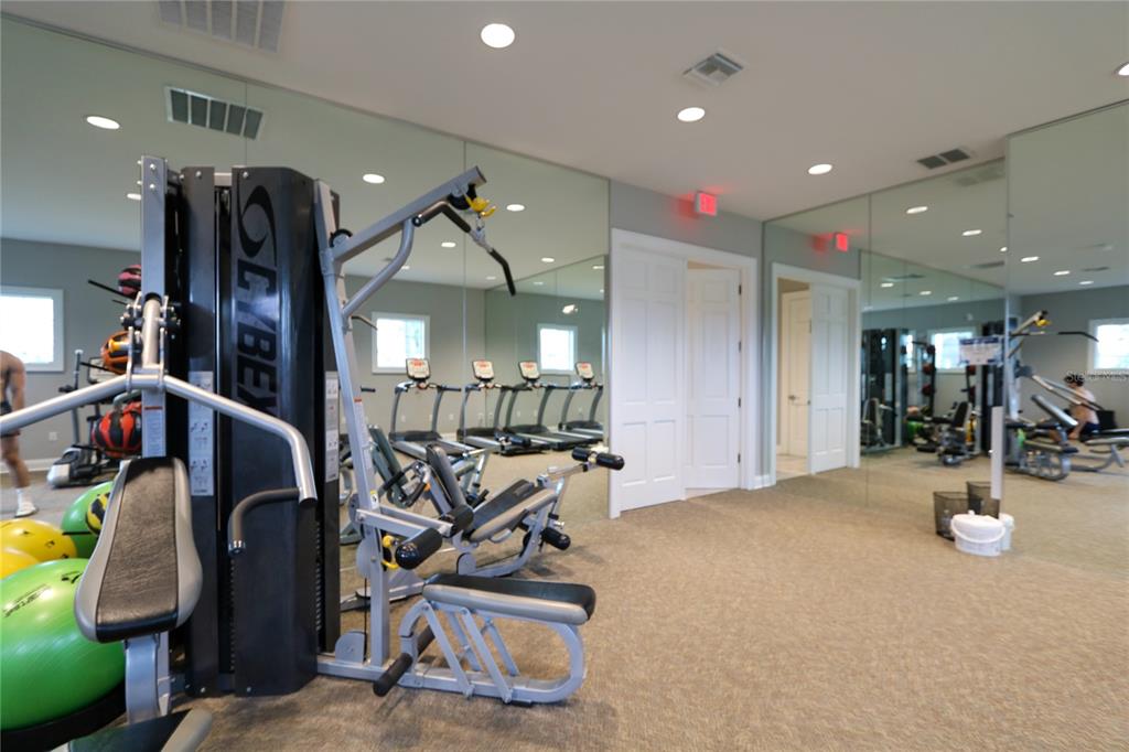 4714 Norman Oak Place Tampa, FL 33619 - Photo 30 of 32 a view of a room with gym equipment