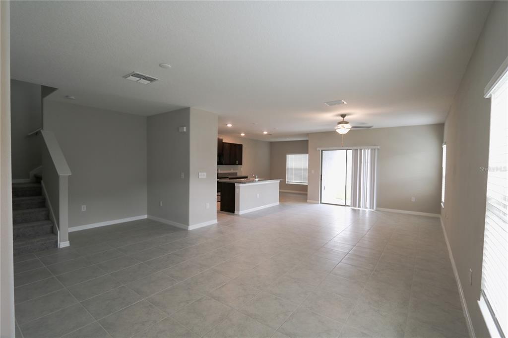 4714 Norman Oak Place Tampa, FL 33619 - Photo 4 of 32 an empty room with windows and pillars in it