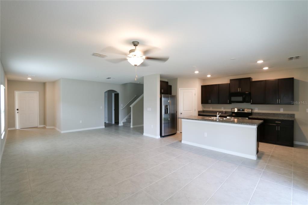 4714 Norman Oak Place Tampa, FL 33619 - Photo 5 of 32 a view of a kitchen with a sink and a stove