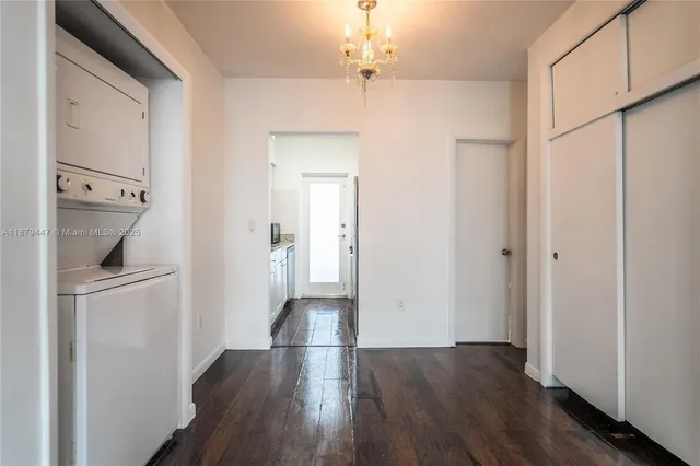 a view of hallway with wooden floor