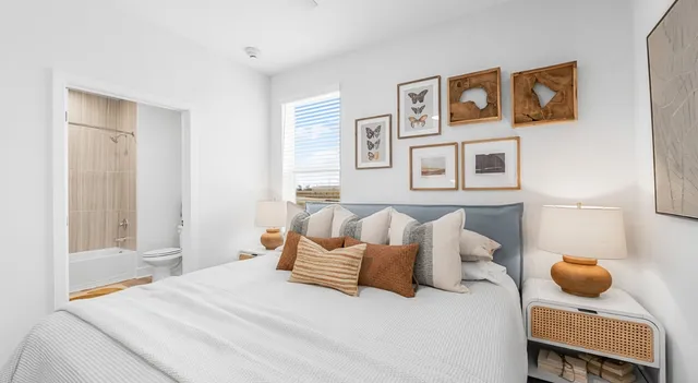 a bedroom with a bed and a couch