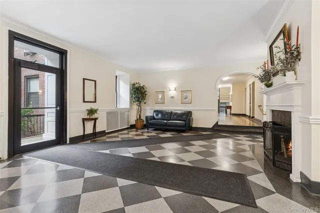 a living room with furniture a fireplace and a table
