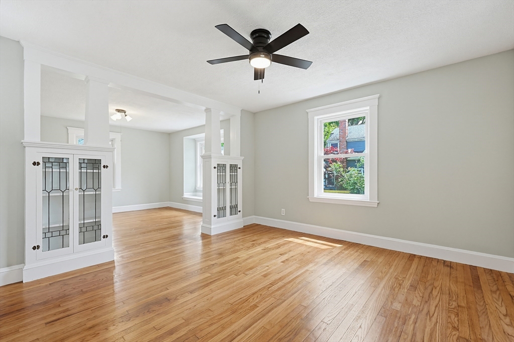10 Water Street Natick, MA 01760 - Photo 3 of 35 wooden floor in an empty room with a window