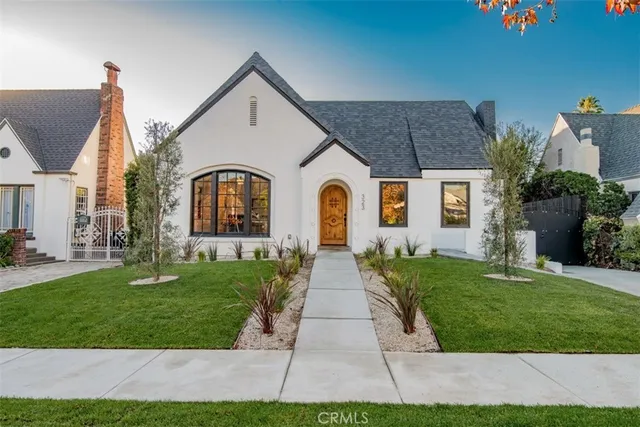 a front view of a house with garden