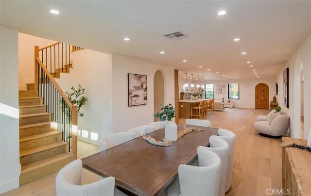 a dining room with furniture window and outside view