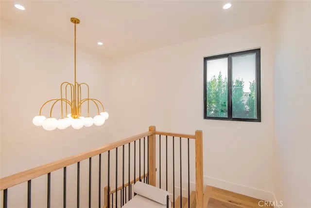 a living room with furniture and large windows