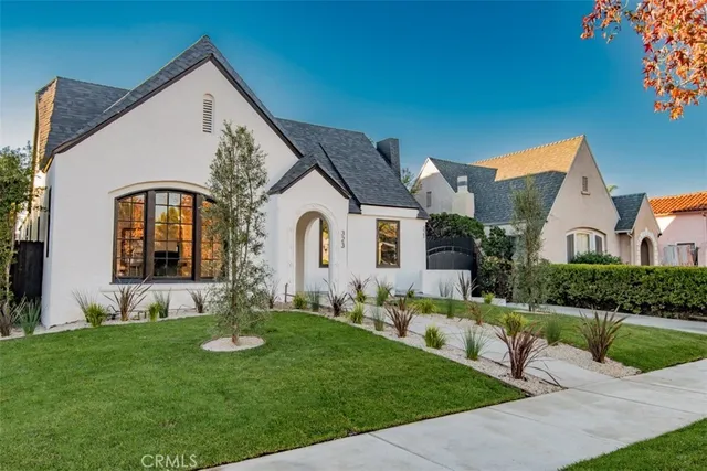 a front view of house with yard and green space