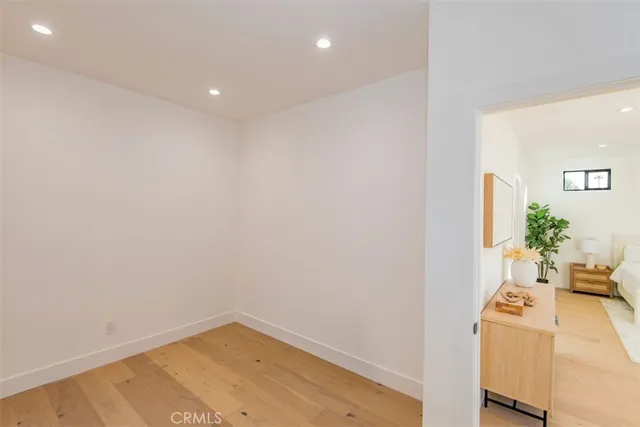 a bathroom with a toilet and a large window