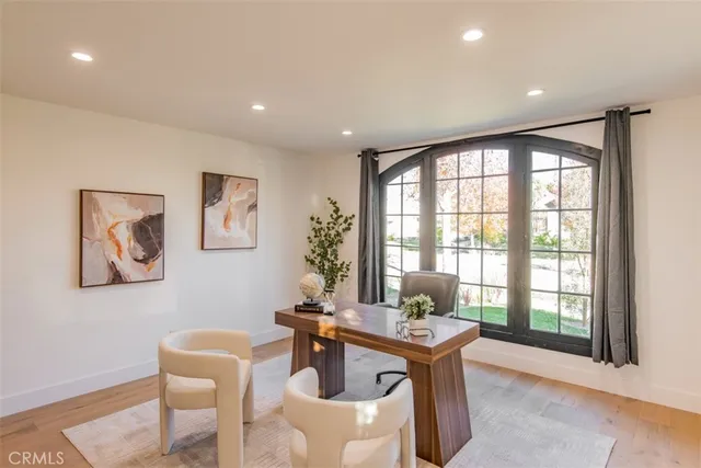 a front view of house with a garden and sitting area