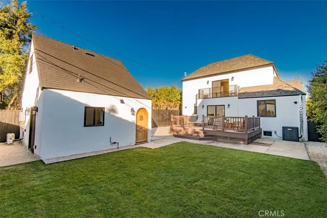a kitchen with stainless steel appliances a stove sink and refrigerator