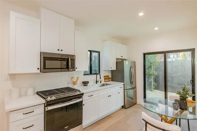 a bedroom with a bed and a night stand