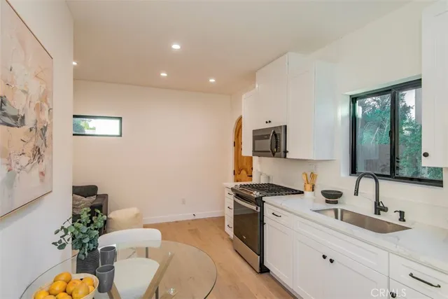 a front view of house with a garden