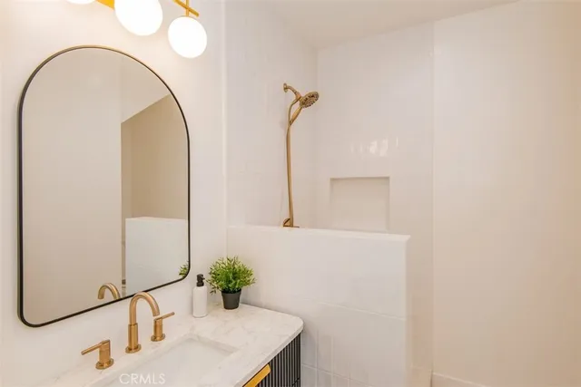 a view of a house with a small yard and wooden fence