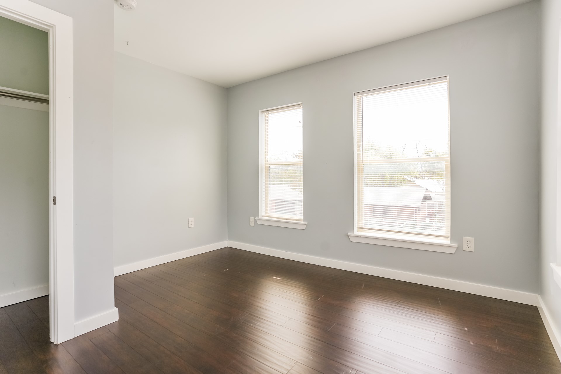 4801 Avenue H Austin, TX 78751 - Photo 13 of 16 Unfurnished bedroom with dark wood-style flooring and a closet