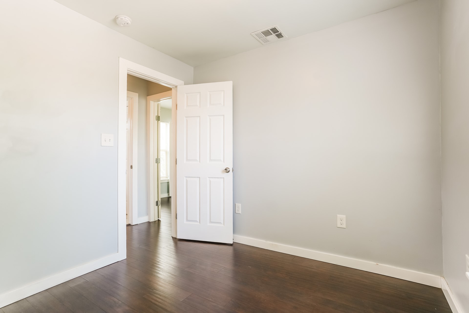 4801 Avenue H Austin, TX 78751 - Photo 2 of 16 Spare room with dark wood-style flooring and baseboards
