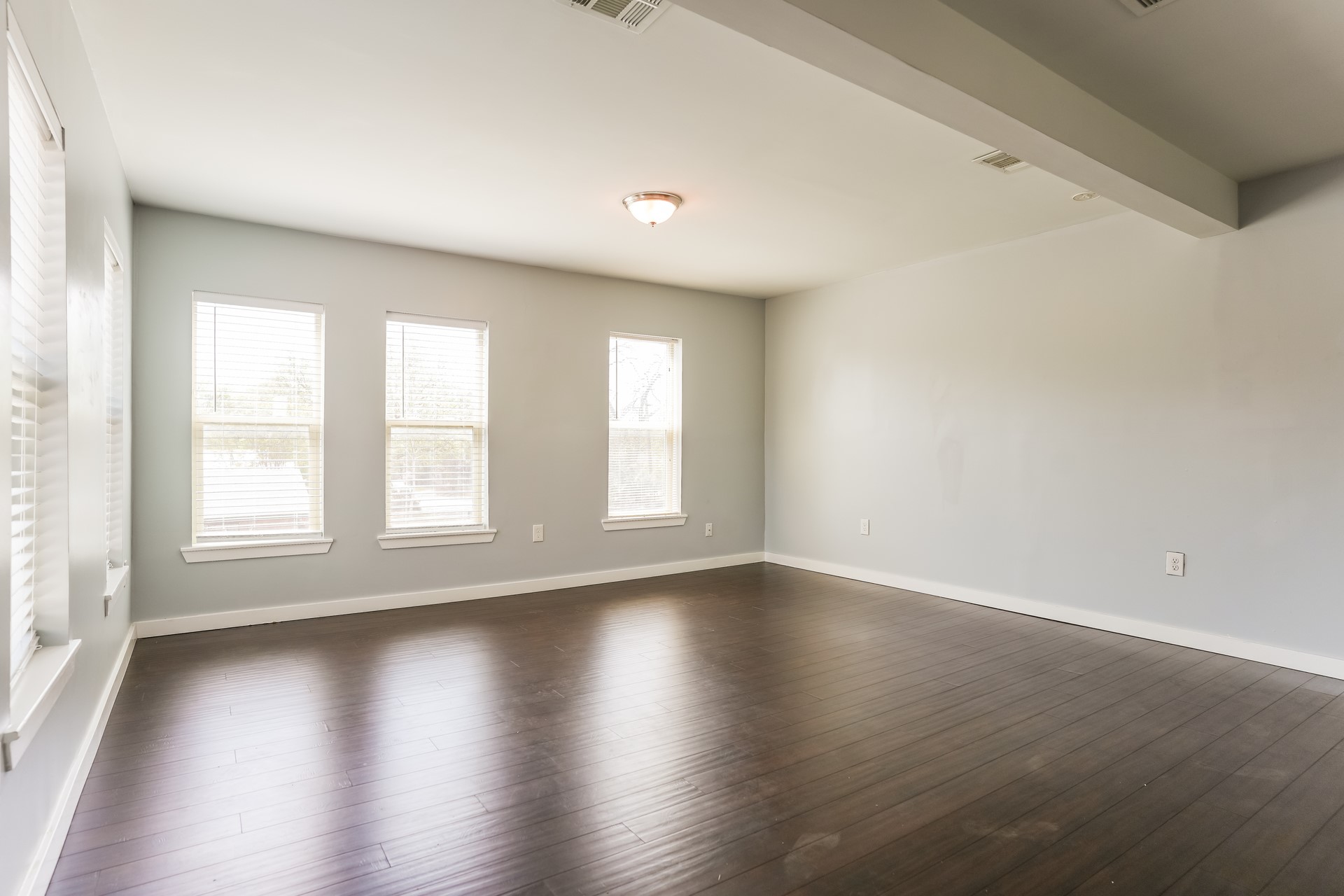 4801 Avenue H Austin, TX 78751 - Photo 8 of 16 Unfurnished room featuring dark wood-type flooring and beamed ceiling