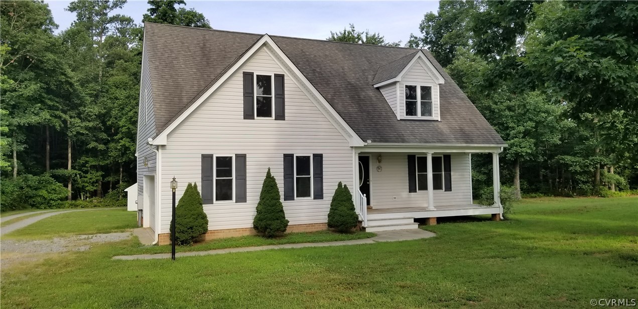 17175 Coatesville Road Beaverdam, VA 23015 - Photo 2 of 16 a view of a white house with a big yard and potted plants